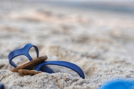 Blue Sandals on the beachの写真素材