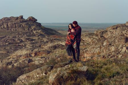 young couple in love walking in the wild wearing city clothesの写真素材