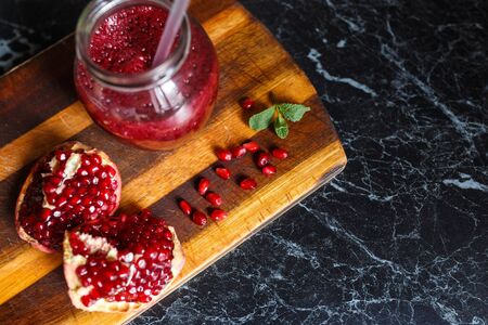 freshly prepared smoothies from banana and pomegranate. Diet, a healthy lifestyleの写真素材