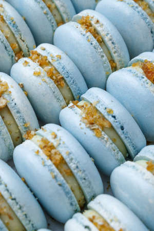 a lot of blue macaroons lie in the package close-up.の写真素材