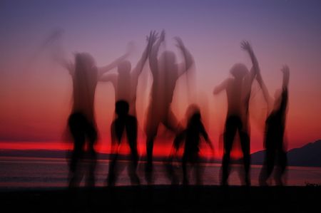People silhouettes in sunset の写真素材
