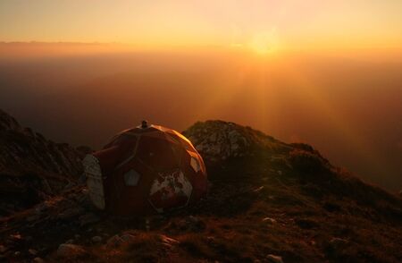 Sunset over mountains. Varful Ascutit refuge, Piatra Craiului mountains, Romaniaの写真素材