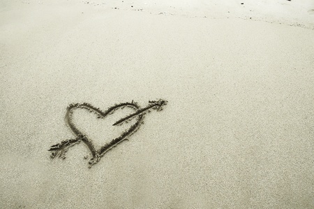 Handwritten heart on sandの写真素材
