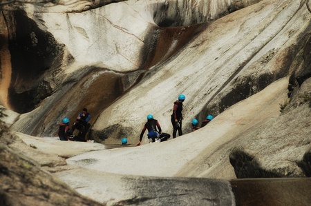 PURCARACCIA CANYON, CORSICA  AUGUST 28: An extreme sports team participates  in a canyoning contest on the famous waterfalls of Purcaraccia valley, on August 28, 2010 in Corsica, Franceのeditorial素材