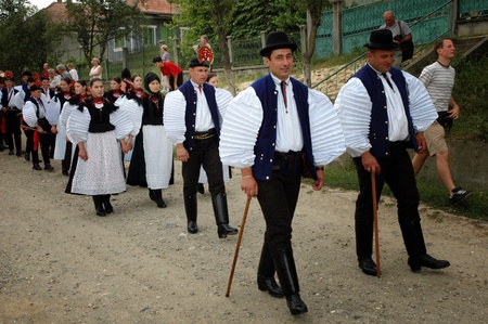 SIC, ROMANIA - CIRCA JUNE, 2004: Celebration of a traditional Hungarian wedding in traditional clothes at the Sic Village Festival Days, at June, 2004, in Sic (Szek), Romania SIC, ROMANIA - CIRCA JUNE, 2004: Celebration of a traditional Hungarian wedding in traditional clothes at the Sic Village Festival Days, at June, 2004, in Sic (Szek), Romania