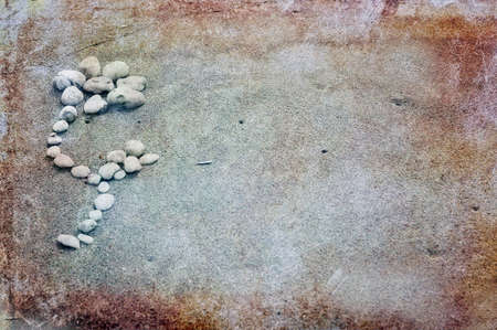 Vintage flower made of stones on grunge backgroundの写真素材