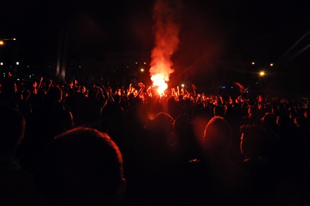 CLUJ NAPOCA, ROMANIA MAY 20: FC CFR Cluj players and supporters celebrating the new league title with fireworks in the stadium on MAY 20, 2012 in Cluj N, Romania のeditorial素材