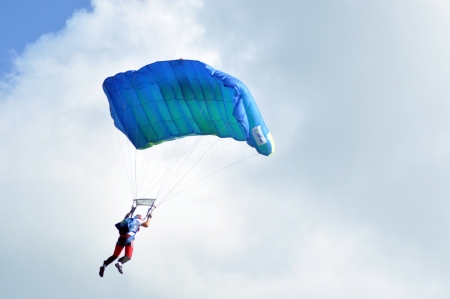 Parachutists flying in the air at the Romanian Air Fest on May 18, 2013 in Cluj Napoca, Romaniaのeditorial素材