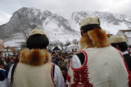 RIMETEA - FEB 28: Local unidentified villagers of Rimetea (Torocko) attending a unique show, the carnival with mask at the ending of winter. On February 28, 2009, in Rimetea, Romania.のeditorial素材