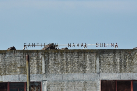 SULINA - JUNE 23: Sulina shipyard was one of the most important shipyards in Europe. After communism fall in Romania, the shipyard became damaged and deserted. On June 23 in Sulina, Romaniaのeditorial素材