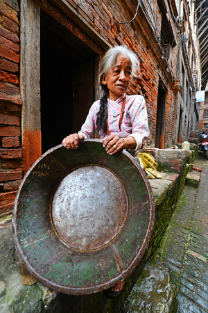 KATHMANDU - OCT 10  People of Kathmandu suburbs trying to survive in the daily life  They live in narrow streets in small apartments without water and electricity  On Oct 10, 2013 in Kathmandu, Nepal のeditorial素材