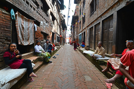 KATHMANDU - OCT 10  People of Kathmandu suburbs trying to survive in the daily life  They live in narrow streets in small apartments without water and electricity  On Oct 10, 2013 in Kathmandu, Nepal のeditorial素材