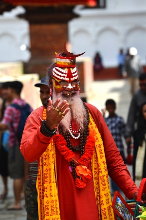KATHMANDU, NEPAL – OCTOBER 8  Holy Sadhu man with dreadlocks and traditional painted face at...