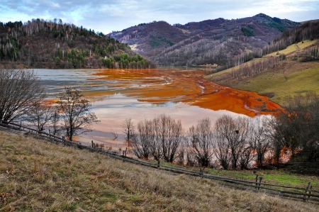 Contaminated lake full with mining waste residuals in Rosia Montana, Romaniaのeditorial素材