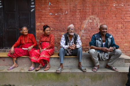 BHAKTAPUR, NEPAL - OCT 11  Nepalese people resting in the historical city of Bhaktapur, Nepal on Oct 11, 2013  Bhaktapur is best known for its rich cultural heritage, especially its arts and crafts のeditorial素材