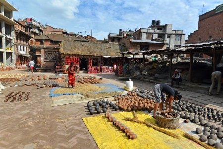 BHAKTAPUR, NEPAL - OCTOBER 10  Bhaktapur pottery square on October 10, 2013 in Bhaktapur, Nepal  Bhaktapur is listed as a World Heritage Site by UNESCO for its rich culture, temples and artwork  のeditorial素材