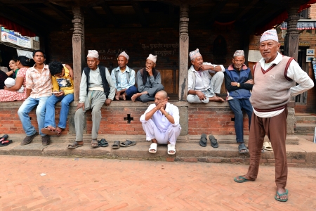 BHAKTAPUR, NEPAL - OCT 11  An old man resting in the historical city of Bhaktapur, Nepal on October 11, 2013  Bhaktapur is best known for its rich cultural heritage, especially its arts and crafts のeditorial素材