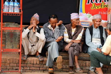 BHAKTAPUR, NEPAL - OCT 11  An old man resting in the historical city of Bhaktapur, Nepal on October 11, 2013  Bhaktapur is best known for its rich cultural heritage, especially its arts and crafts のeditorial素材