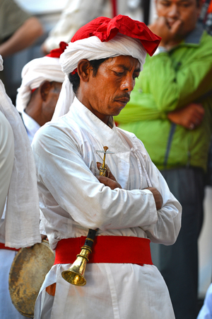 KATHMANDU - OCT 11  Musician of the Nepalese Military Orchestra waiting for the show, in the inner courtyard of the Royal Palace, during the Dasain festival  On October 11, 2013 in Kathmandu, Nepalのeditorial素材
