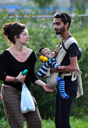 BONTIDA - JUNE 19  Crowd of partying people during a live concert at Electric Castle Festival on June 19, 2014 in the Banffy castle in Bontida, Romaniaのeditorial素材
