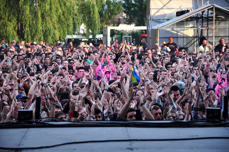 BONTIDA - JUNE 22  Crowd of partying people during a live concert at Electric Castle Festival on June 22, 2014 in the Banffy castle in Bontida, Romaniaのeditorial素材