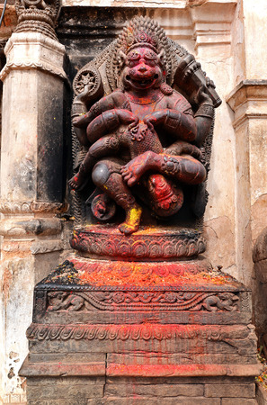 Old deity of Narasimha, the avatar of the Hindu god Vishnu, in a public square in Bhaktapur, Nepalの写真素材