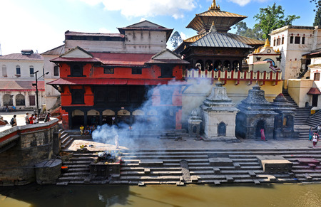PASHUPATINATH  OCTOBER : Cremation ghats and ceremony along the holy Bagmati River. Hundreds of earthquake victims were cremated here after the catastrophe. On October 8 2013 in Pashupatinath Nepalのeditorial素材
