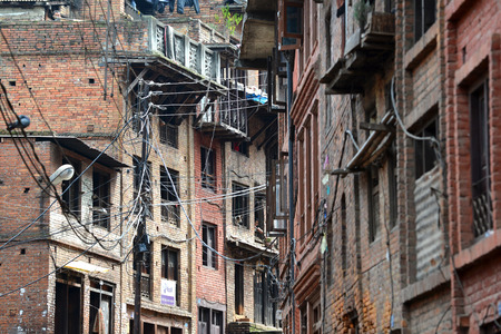 KATHMANDU  OCT 10: People of Kathmandu suburbs living in narrow streets in small apartments without water and electricity. On Oct 10 2013 in Kathmandu Nepalのeditorial素材