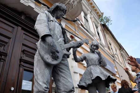 CLUJ NAPOCA  MAY 24: World Champions called Beeldje Living Statues from Netherland doing a busking mime called Sing along inside the Man.In.Fest during the Cluj Days of Cluj. On May 24 2015 in in Cluj Romaniaのeditorial素材