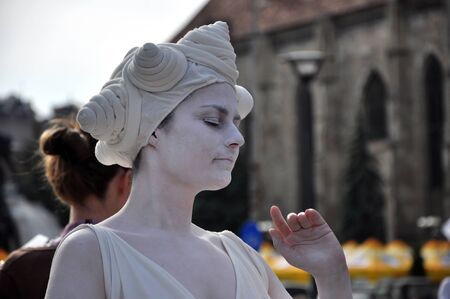 CLUJ NAPOCA  MAY 24: Living statue woman street performer doing a busking mime inside the Man.In.Fest during the Cluj Days of Cluj. On May 24 2015 in in Cluj Romaniaのeditorial素材
