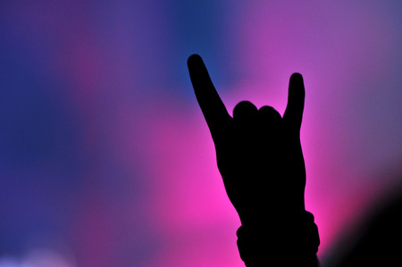 Hand doing rock sign at a live rock concertのeditorial素材