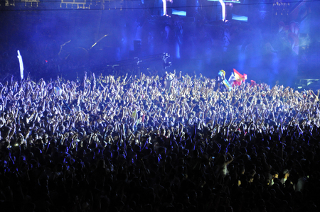 CLUJ NAPOCA, ROMANIA  JULY 31, 2015: Crowd of partying people dancing during a Casette live concert at the Untold Festival in the European Youth Capital city of Cluj Napocaのeditorial素材