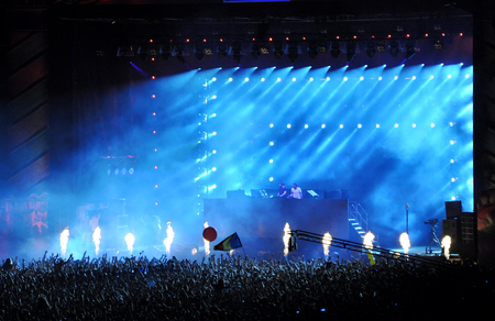 CLUJ NAPOCA, ROMANIA  JULY 30, 2015: Crowd of partying people enjoy a Dimitri Vegas and Like Mike live concert at the Untold Festival in the European Youth Capital city of Cluj Napocaのeditorial素材
