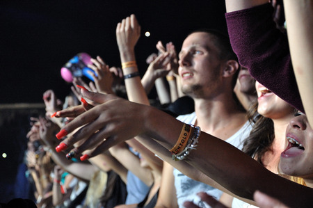 CLUJ NAPOCA, ROMANIA  JULY 30, 2015: Crowd of cheerful young people having fun during a live concert at Untold Festival in the European Youth Capital city of Cluj Napocaのeditorial素材