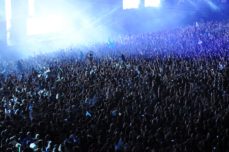 CLUJ NAPOCA, ROMANIA  JULY 31, 2015: Crowd of party people raising their hands during an Avicii live concert at the Untold Festivalのeditorial素材