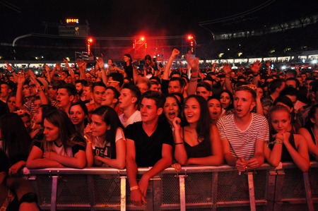 CLUJ NAPOCA, ROMANIA  JULY 30, 2015: Crowd of cheerful young people having fun during a live concert at Untold Festival in the European Youth Capital city of Cluj Napocaのeditorial素材