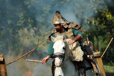 CLUJ-NAPOCA, ROMANIA - OCTOBER 3: Members of Eagles of Calata Nomadic group performing a free equestrian demonstration with Hunnic and archaic Hungarian costumes. On October 3, 2015 in Cluj, Romaniaのeditorial素材