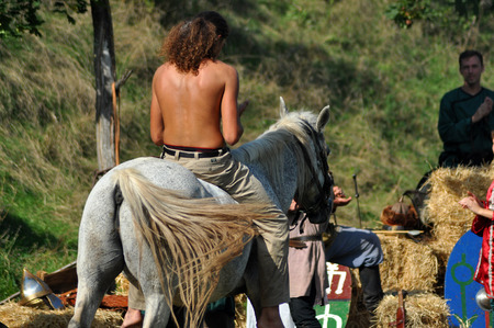 CLUJ-NAPOCA, ROMANIA - OCTOBER 3: Members of Eagles of Calata Nomadic group performing a free equestrian demonstration with Hunnic and archaic Hungarian costumes. On October 3, 2015 in Cluj, Romaniaのeditorial素材