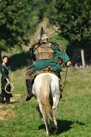 CLUJ-NAPOCA, ROMANIA - OCTOBER 3: Members of Eagles of Calata Nomadic group performing a free equestrian demonstration with Hunnic and archaic Hungarian costumes. On October 3, 2015 in Cluj, Romaniaのeditorial素材