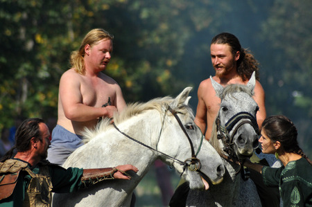 CLUJ-NAPOCA, ROMANIA - OCTOBER 3: Members of Eagles of Calata Nomadic group performing a free equestrian demonstration with Hunnic and archaic Hungarian costumes. On October 3, 2015 in Cluj, Romaniaのeditorial素材