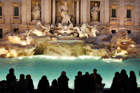 ROME, ITALY - MARCH 14, 2016: Tourists visiting the Trevi fountain (Fontana di Trevi), one of the major tourist attraction of Rome, Italyのeditorial素材