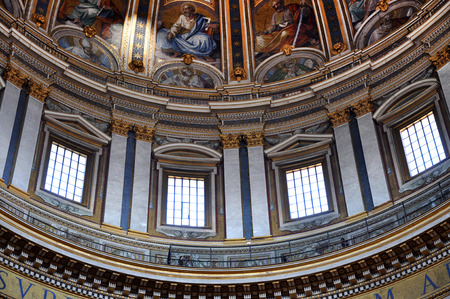 VATICAN, ITALY - MARCH 16, 2016: The ceiling of the Saint Peter basilica was painted over decades...