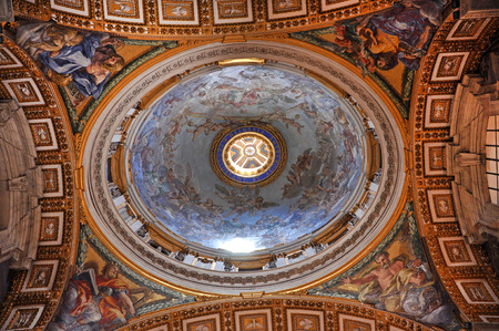 VATICAN, ITALY - MARCH 16, 2016: The ceiling of the Saint Peter basilica was painted over decades and is visited daily by thousands of tourists and religious peopleのeditorial素材