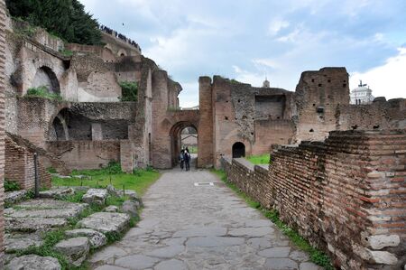 ROME, ITALY - MARCH 15, 2016: Tourists visiting the archaeological site of the Roman Forum (Foro Romano) near the Colosseum, part of Unesco heritage in Rome, Italyのeditorial素材