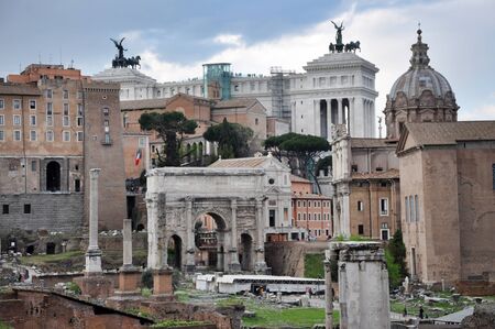 ROME, ITALY - MARCH 15, 2016: Tourists visiting the archaeological site of the Roman Forum (Foro Romano) near the Colosseum, part of Unesco heritage in Rome, Italyのeditorial素材
