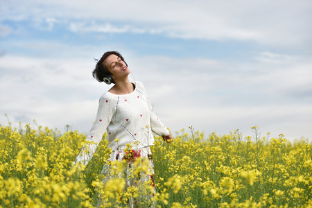 Sexy young woman with headphones dancing in the outdoorsの写真素材