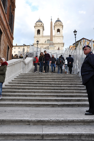 ROME, ITALY - MARCH 14, 2016: Tourists visiting the Piazza di Spagna (Spanish square), the Spanish Steps and the Fontana della Barcaccia in Romeのeditorial素材