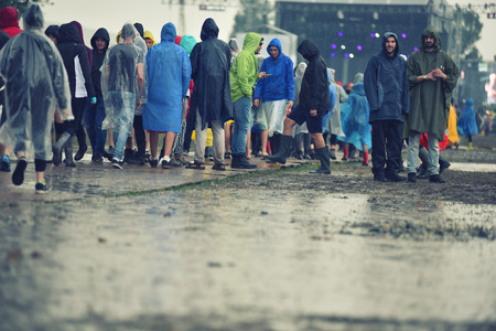 BONTIDA, ROMANIA - JULY 16, 2016: People living heavy rainy days at Electric Castle Festival. After 3 days of raining the area of the festival became extremly muddy and wetのeditorial素材