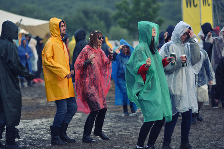 BONTIDA, ROMANIA - JULY 16, 2016: People living heavy rainy days at Electric Castle Festival. After 3 days of raining the area of the festival became extremly muddy and wetのeditorial素材