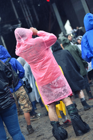 BONTIDA, ROMANIA - JULY 16, 2016: People living heavy rainy days at Electric Castle Festival. After 3 days of raining the area of the festival became extremly muddy and wetのeditorial素材